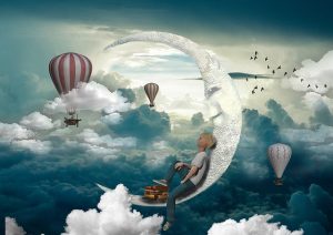 Cloudy sky with a crescent moon on which rests a child daydreaming